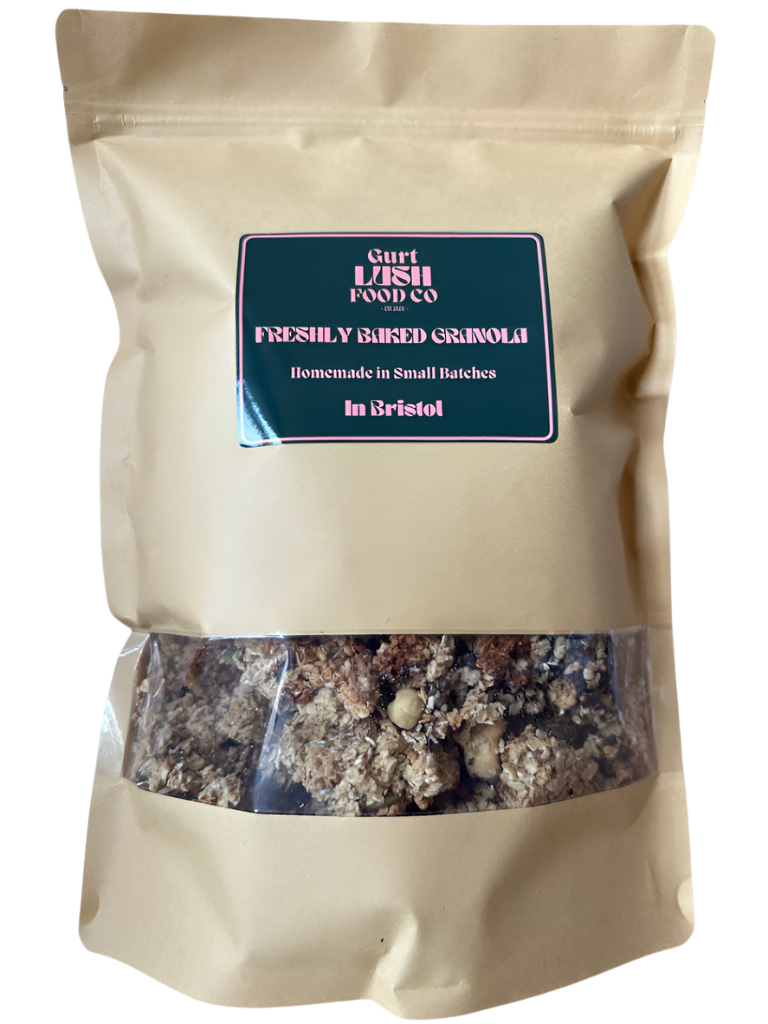 Beige bag of freshly baked granola with a visible label on a white background