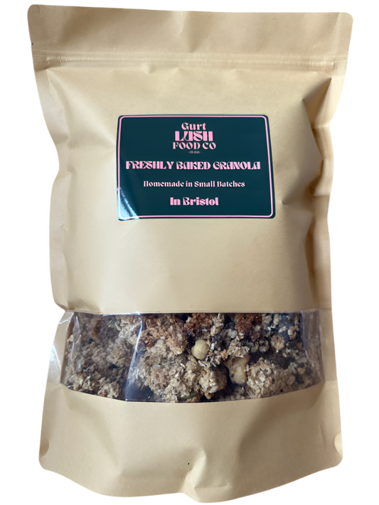 Beige bag of freshly baked granola with a visible label on a white background