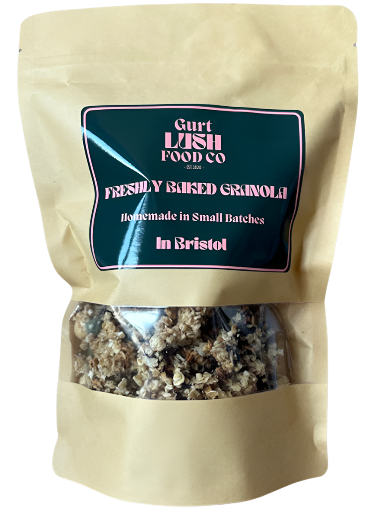 Beige bag of freshly made granola with a visible label on a white background