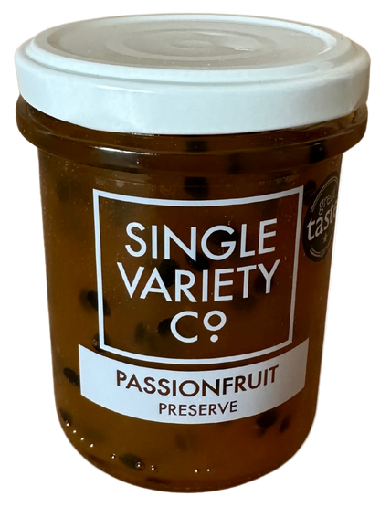 Jar of passionfruit preserve with a white lid on a white background