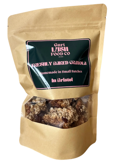 Kraft paper packaging of freshly baked granola with a visible brand label on a white background