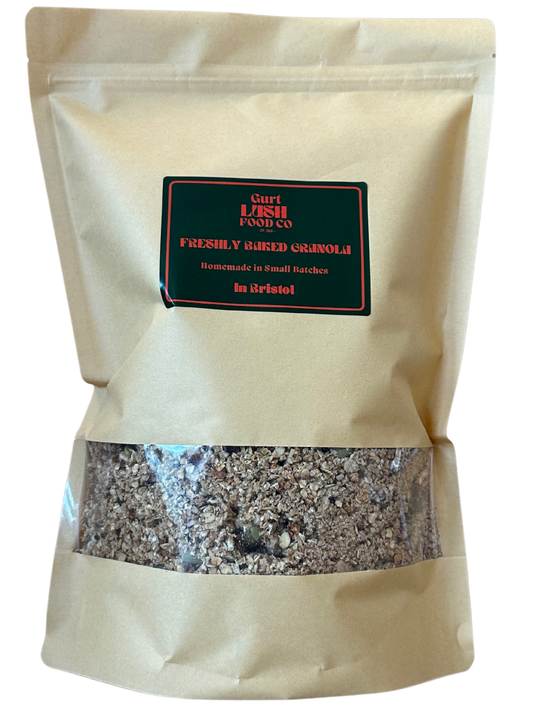 Beige bag of freshly baked granola with a visible label on a white background