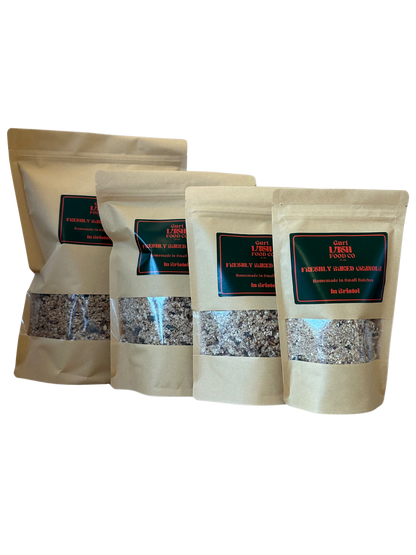 Four beige paper bags with visible contents on a white background