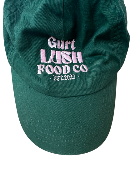 Green cap with 'Gurt Lush Food Co. EST. 2020' text on a white background
