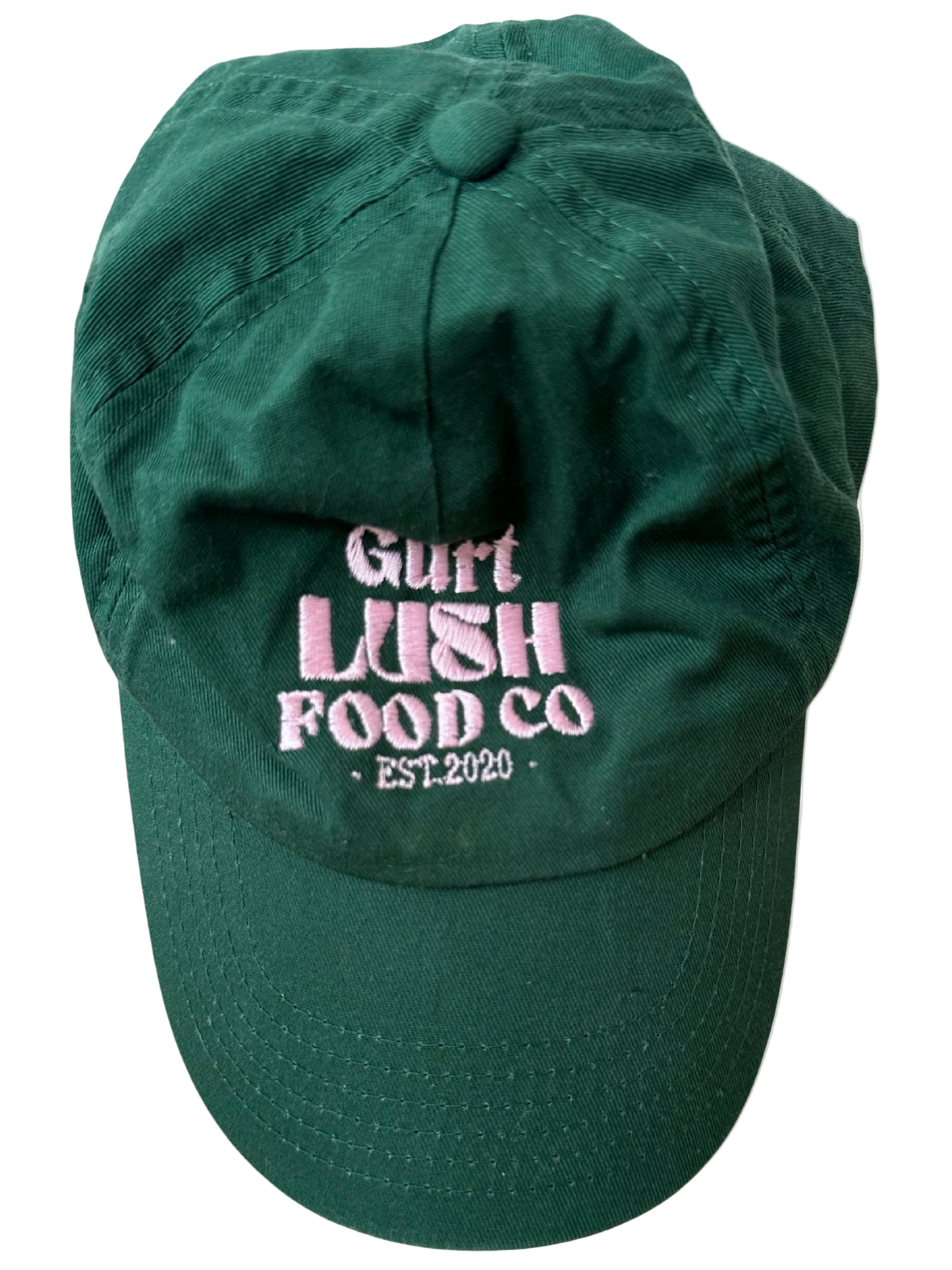 Green cap with pink text 'Gurt Lush Food Co. Est. 2020' on a white background